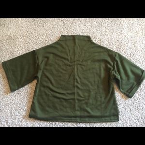 Green high-neck cropped top